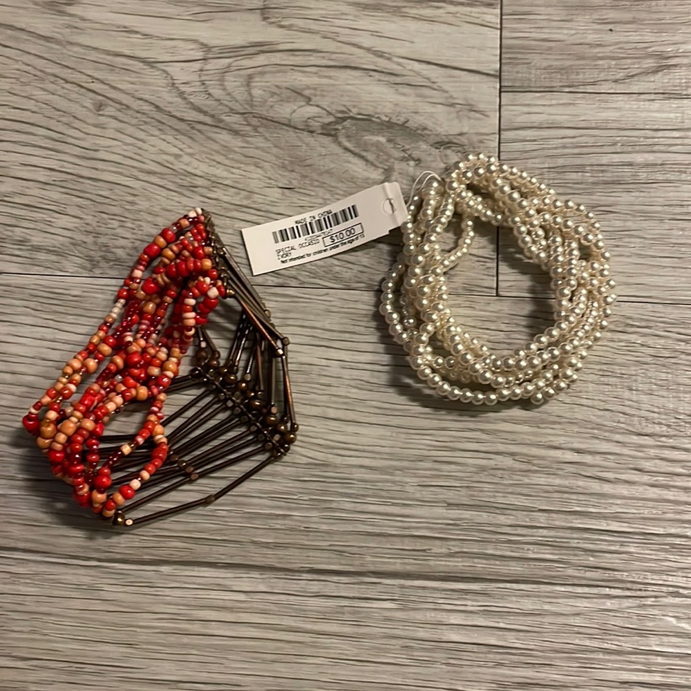 Two bracelets - one white pearl the other pink with gold